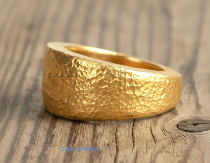 Hammered 24k Gold 9999 gold signet thick ring Ancient Rome style with textured gold on old wooden background, branded 'Ella Kripaka'