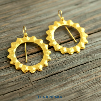 Hammered 24k 9999 Gold convex hoops Sun earrings Ancient Rome and Byzantine style on a old wooden background, and artist-jeweler's name 'Ella Kripaka' branding