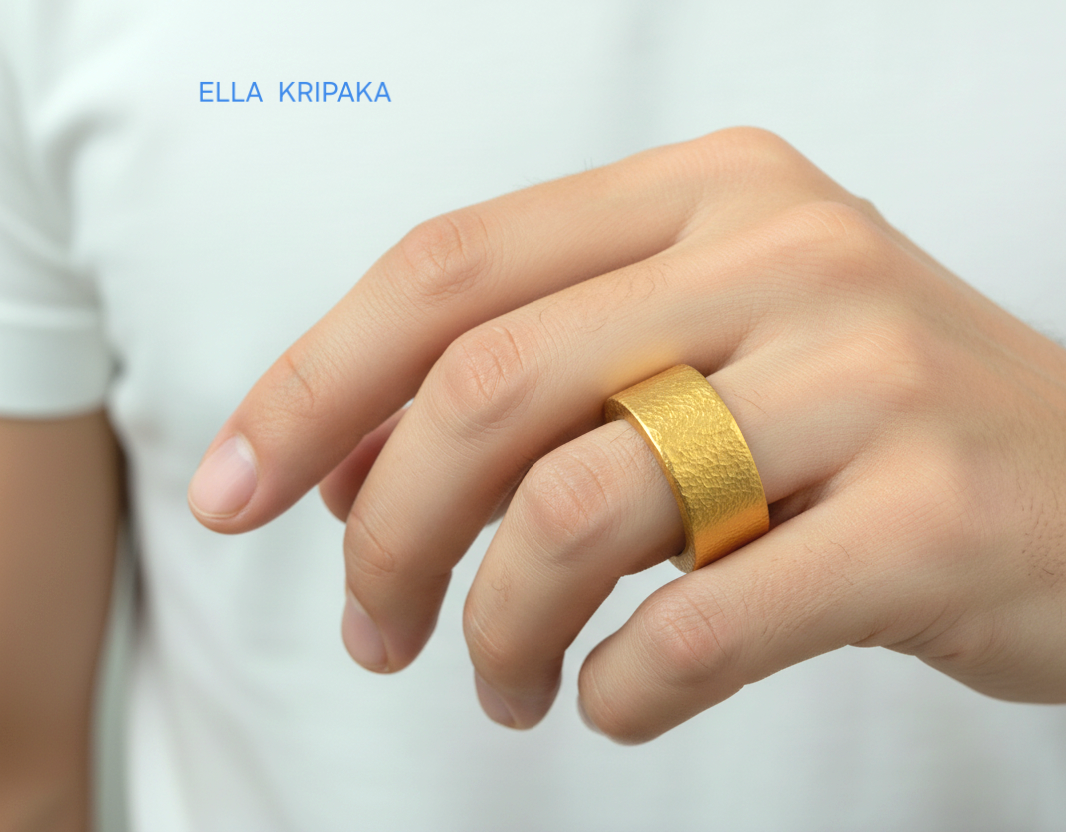 Hammered 24k Gold 9999 gold thick ring band with textured gold worn on model's finger and on a white background, branded 'Ella Kripaka'
