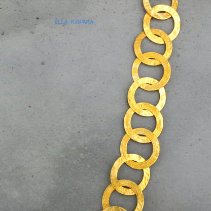 22k gold hammered chain necklace on a grey background, artist-jeweler's name 'Ella Kripaka' branding