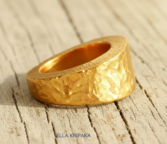 Hammered 24k 9999 Gold ring thick signet Ancient Rome style on old wooden surface, artist-jeweler's name 'Ella Kripaka' branding