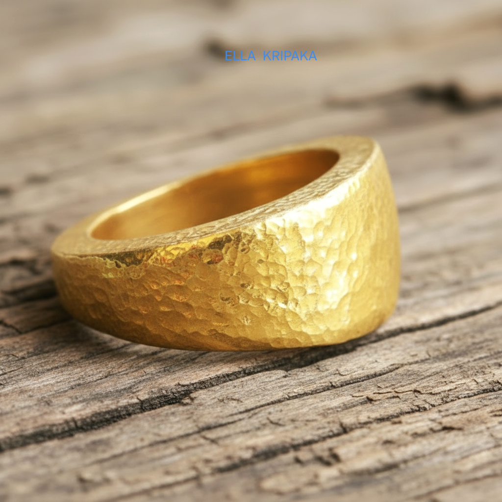 Hammered 24k Gold 9999 gold signet thick ring Ancient Rome style with textured gold on old wooden background, branded 'Ella Kripaka'