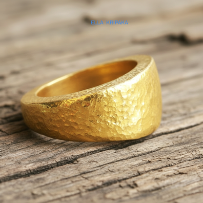 Hammered 24k Gold 9999 gold signet thick ring Ancient Rome style with textured gold on old wooden background, branded 'Ella Kripaka'