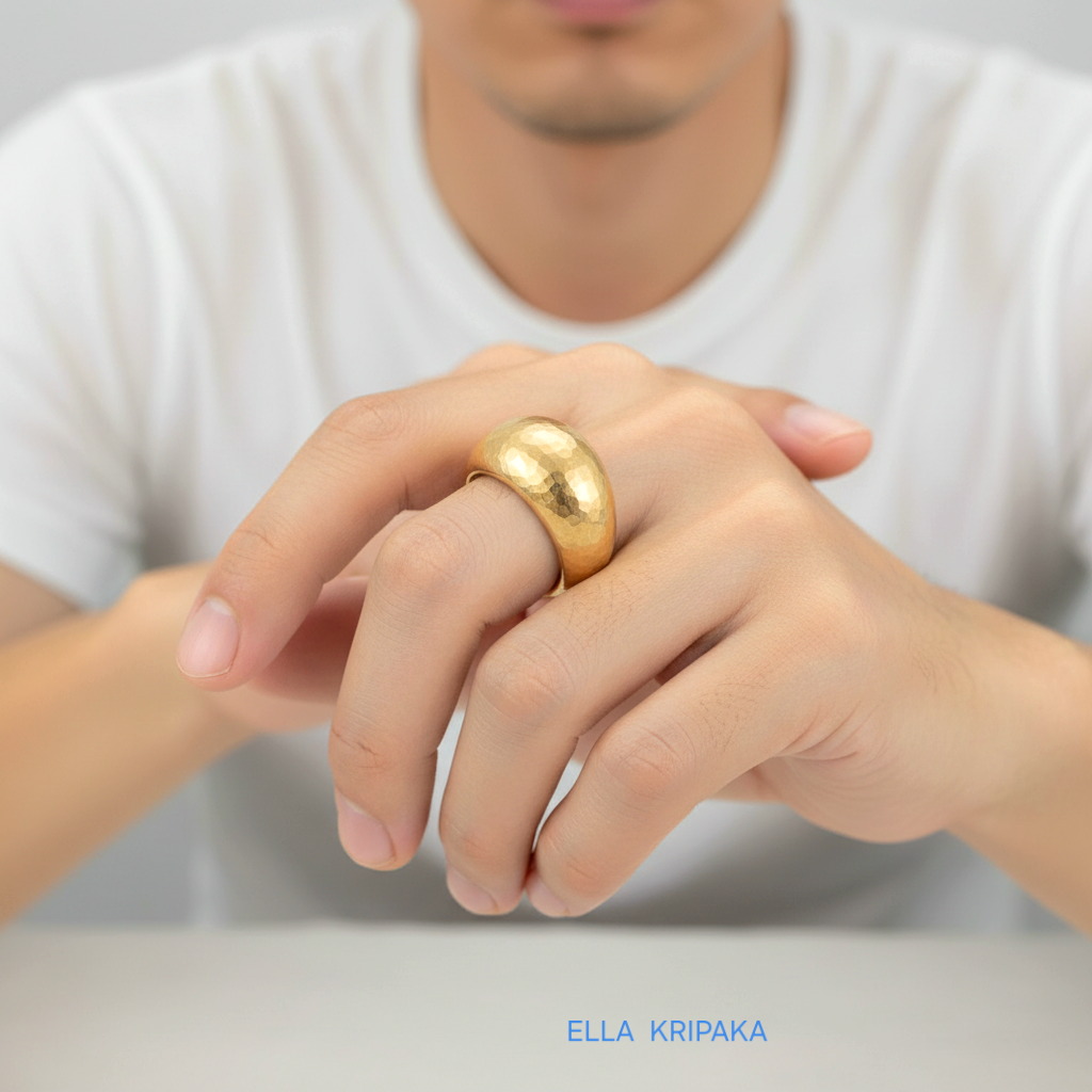 Hammered 24k 9999 Gold ring convex signet Ancient Rome style is worn by a person on finger and on white background, artist-jeweler's name 'Ella Kripaka' branding