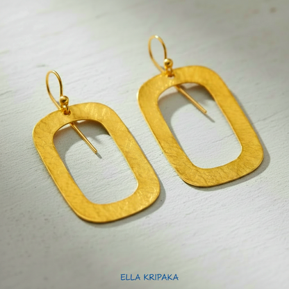 24k gold hammered textured rectangular hoops earrings on light grey craft paper background,  arist-jeweler 'Ella Kripaka' branding