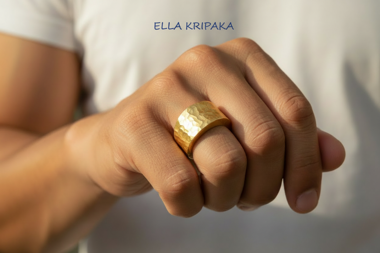 Hammered 24k 9999 Gold ring thick signet Ancient Rome style is worn by a person on finger and on white background, artist-jeweler's name 'Ella Kripaka' branding