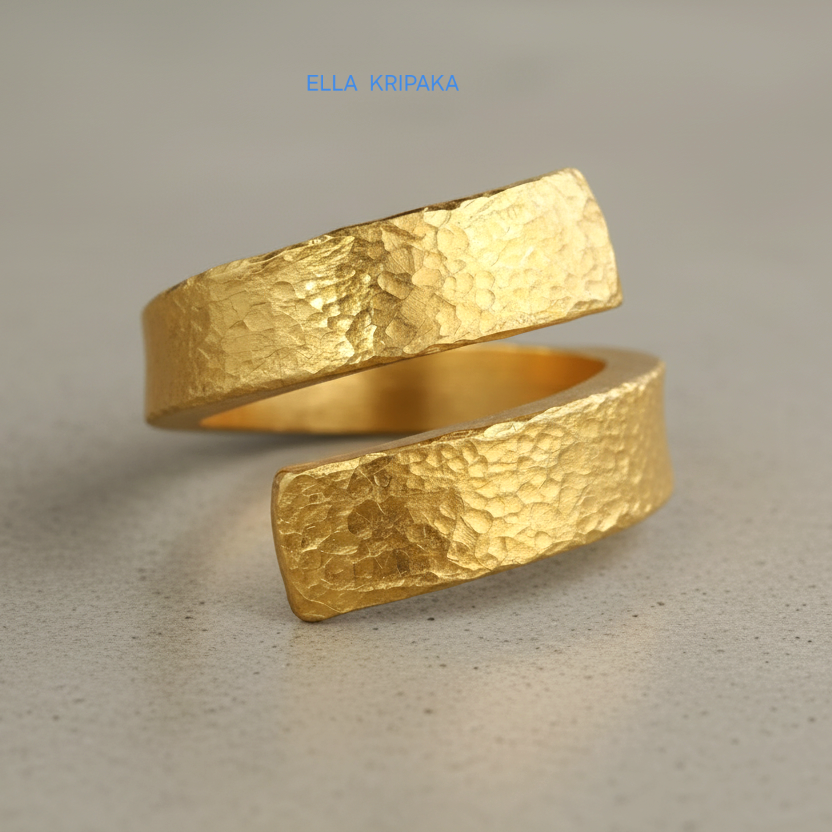 Hammered twisted 24k Gold 9999 gold signet thick ring band with textured gold on a grey concrete background, branded 'Ella Kripaka'