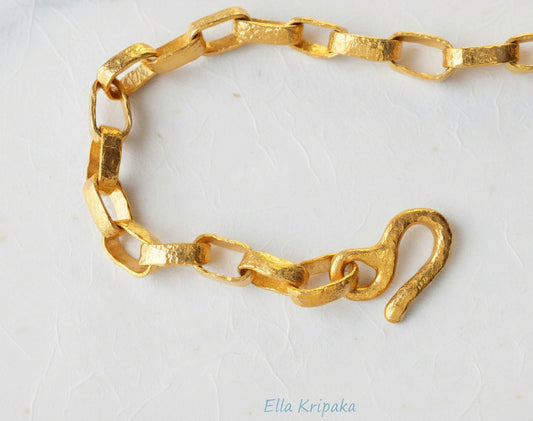 Hammered 24k chain necklace Ancient Rome style with thick hook clasp on a white paper background, branding artist-jeweler name 'Ella Kripaka'