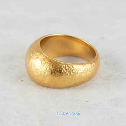 Hammered 24k 9999 Gold ring convex signet Ancient Rome style on white paper surface, artist-jeweler's name 'Ella Kripaka' branding