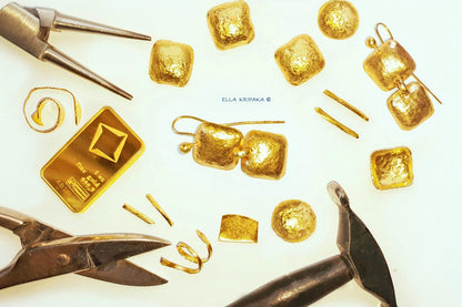 Hammered 24k gold square earrings with 9999 gold bar and gold pieces and with jewelry tools on white background, artist name 'Ella Kripaka' branding
