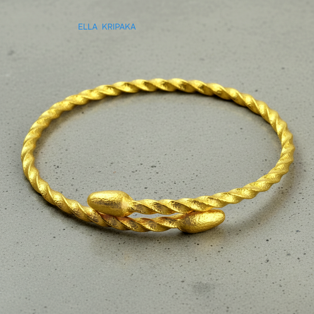 Twisted 24k gold hammered bracelet with oval ends and with textured design on grey polishing concrete surface, branded artist-jeweler 'Ella Kripaka'