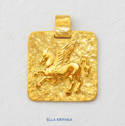 Hammered 24k Gold 9999 gold square pendant with convex Pegasus and with textured gold on white craft paper background, branded artist's name 'Ella Kripaka'