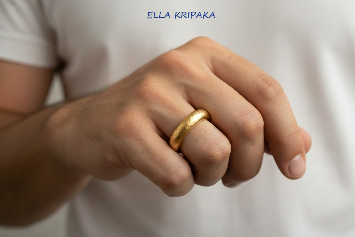 Hammered 24k 9999 Gold ring thick Ancient Rome style is worn by a person on finger and on white background, artist-jeweler's name 'Ella Kripaka' branding