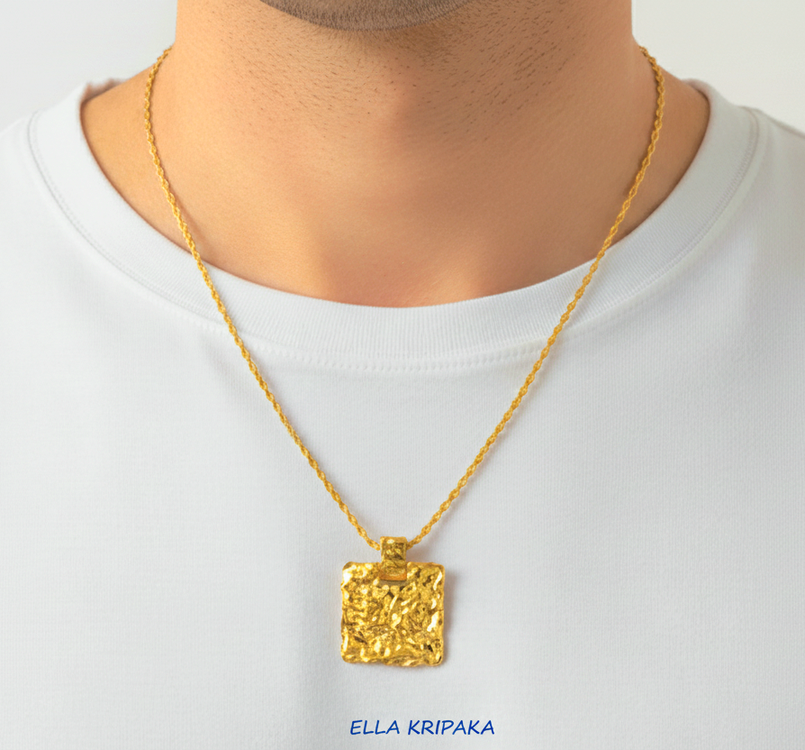 Organic 24k gold wavy textured square pendant hammered with uneven edges and with chain is worn by a model and with white t-shirt background, with 'Ella Kripaka' branding
