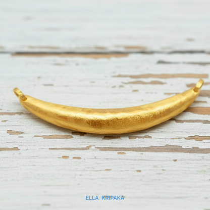 Hammered 24k gold convex Moon pendant on a white rustic wooden background with 'Ella Kripaka' branding