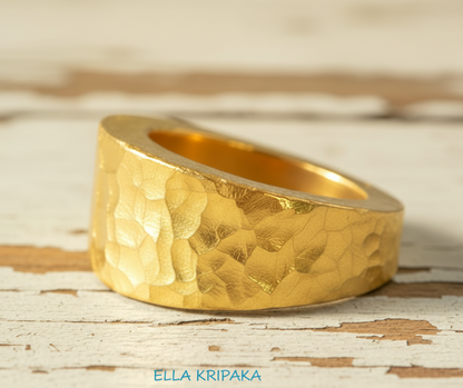 Hammered 24k 9999 Gold ring thick signet Ancient Rome style on old wooden surface, artist-jeweler's name 'Ella Kripaka' branding