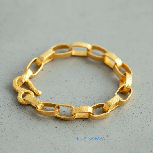 Hammered 24k 9999 gold chain thick bracelet with thick hook clasp Ancient Rome style on a grey background, artist-jeweler name 'Ella Kripaka' branding