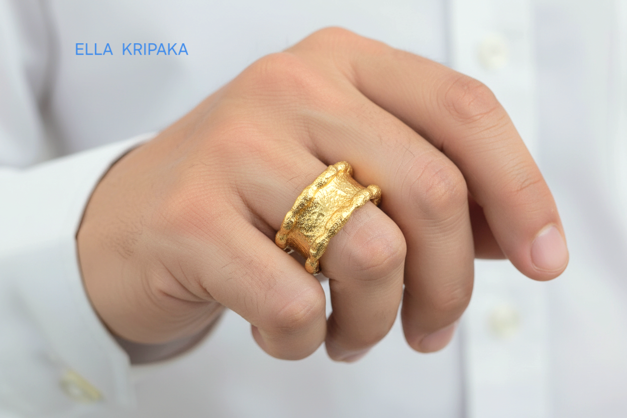 Hammered 24k 9999 Gold thick uneven wavy ring organic band on man's finger and on a white shirt background, branded 'Ella Kripaka'