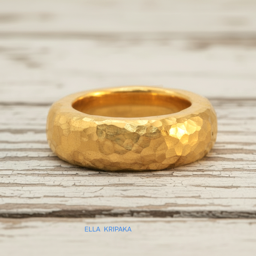 Hammered 24k Gold 9999 gold Ancient Rome  thick ring band with textured gold on a white rustic wooden background, branded 'Ella Kripaka'