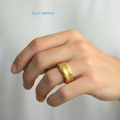 Hammered organic 24k Gold 9999 gold thick wavy ring band with textured gold worn on model's finger and on a white background, branded 'Ella Kripaka'